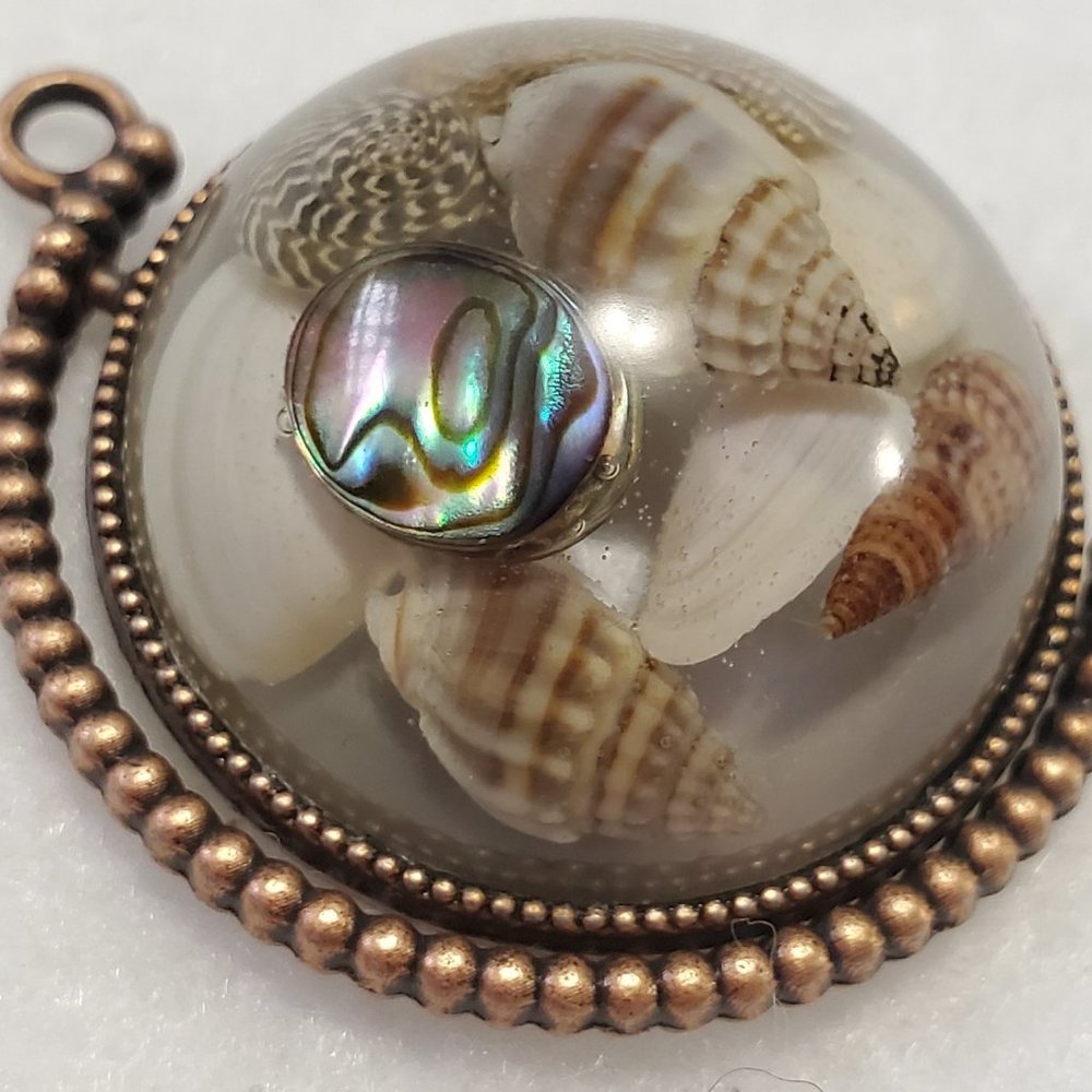 Seashells In Resin With Copper Bezel